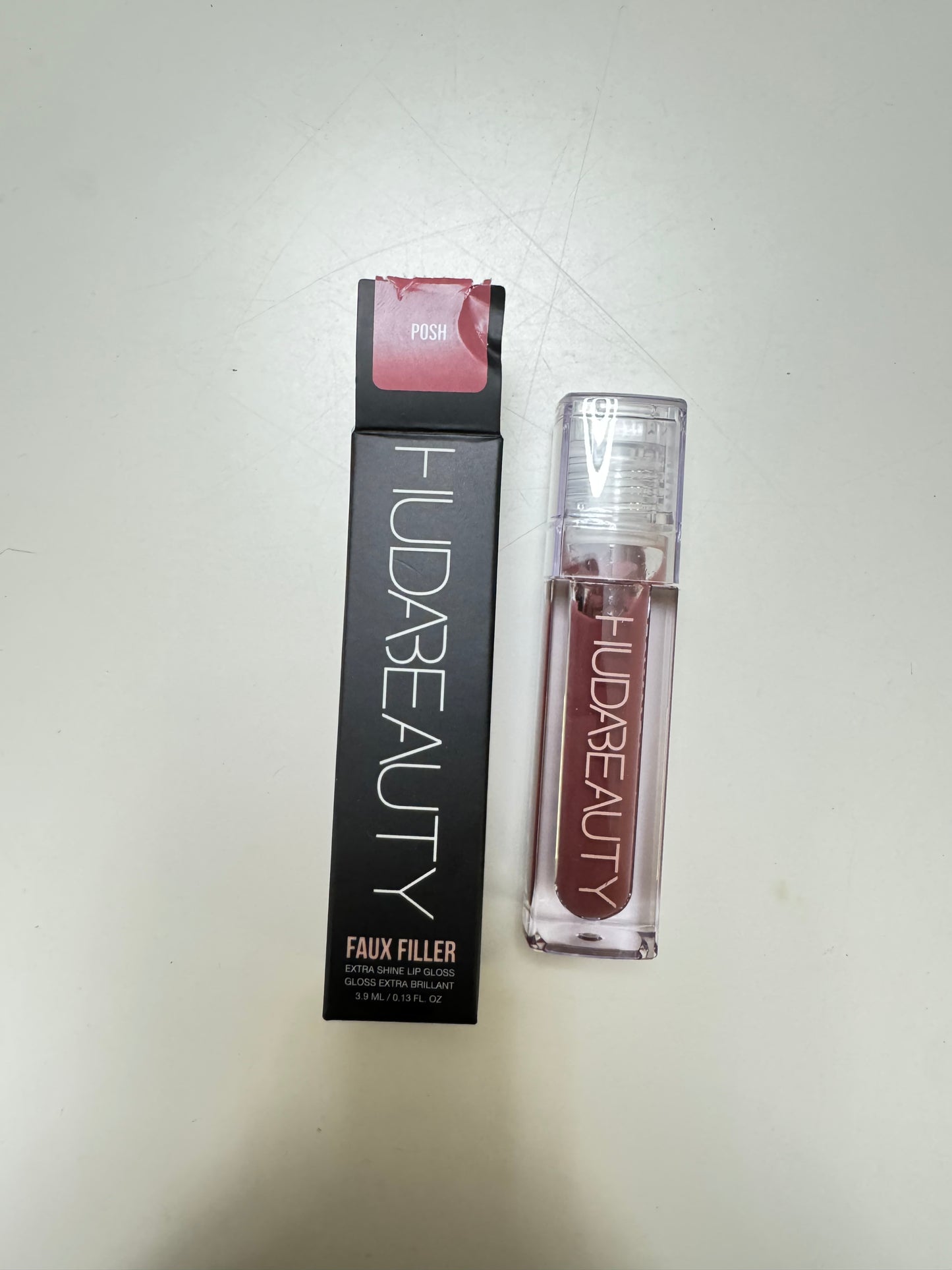 HUDA BEAUTY
Faux Filler Shiny Non-Sticky Lip Gloss